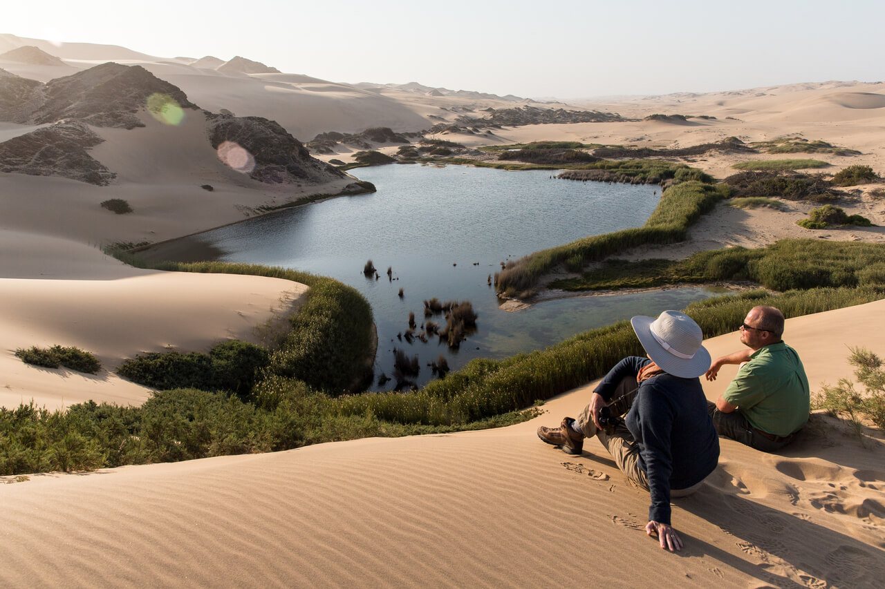 The vastness of the Namib Desert spreads around you