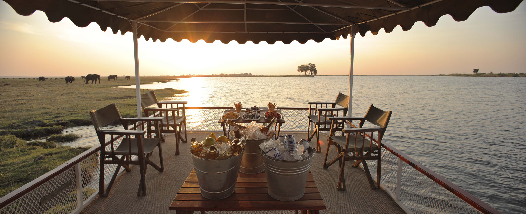 Chobe Under Canvas Camp with view of elephants roaming in Chobe National Park, Botswana