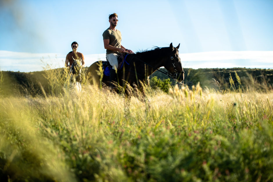 Two men on horseback for horseback riding safari at Tswalu Private Game Reserve