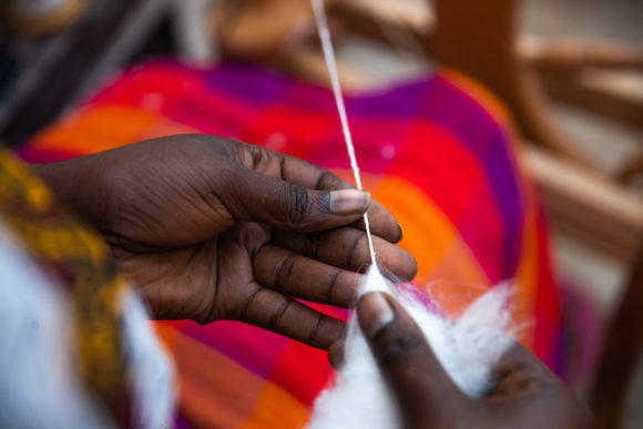 Woman weaving at Gorillas Nest, Rwanda