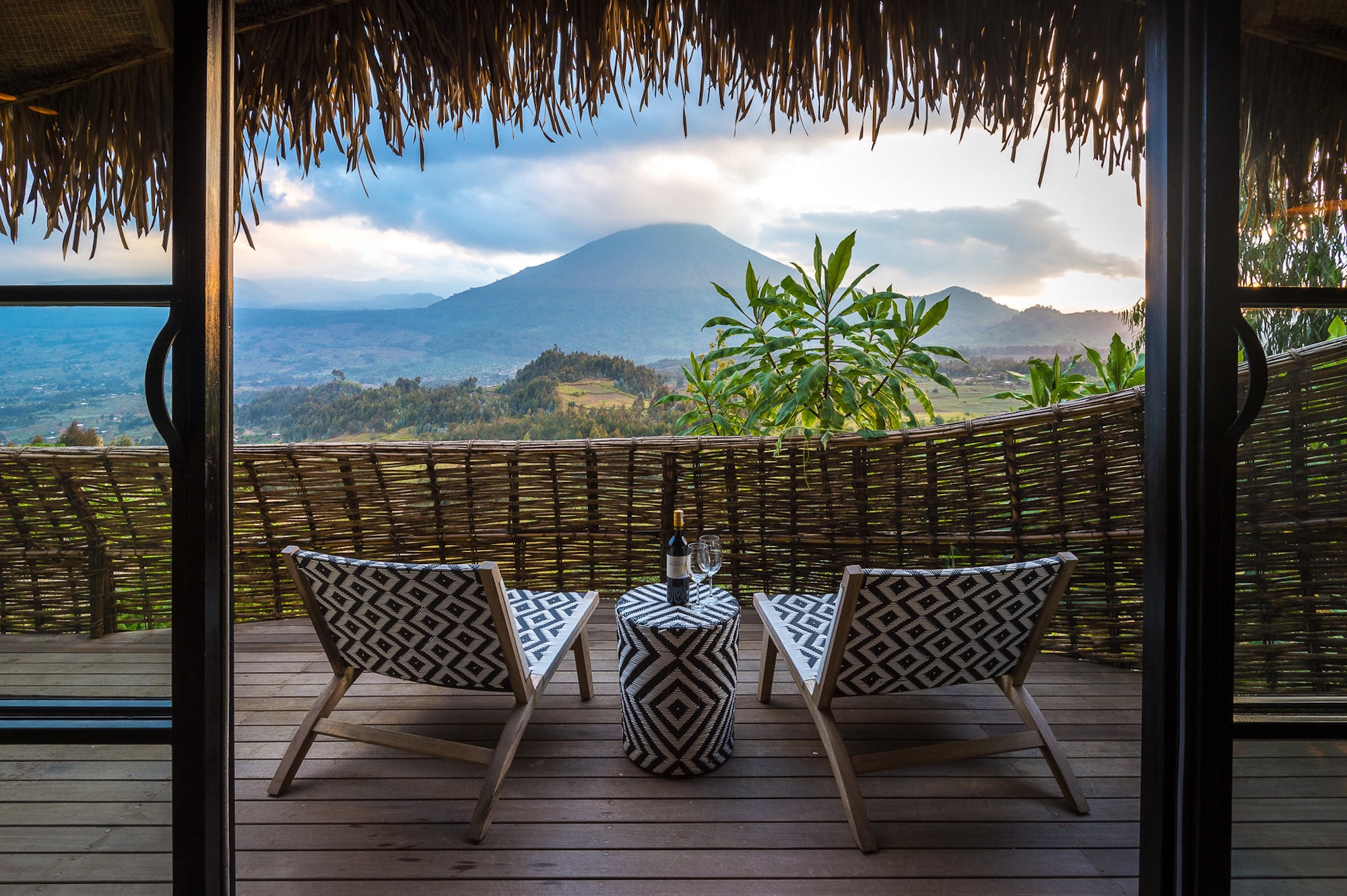 A private deck overlooking Volcanoes National Park during the drier season, the best time to visit Rwanda