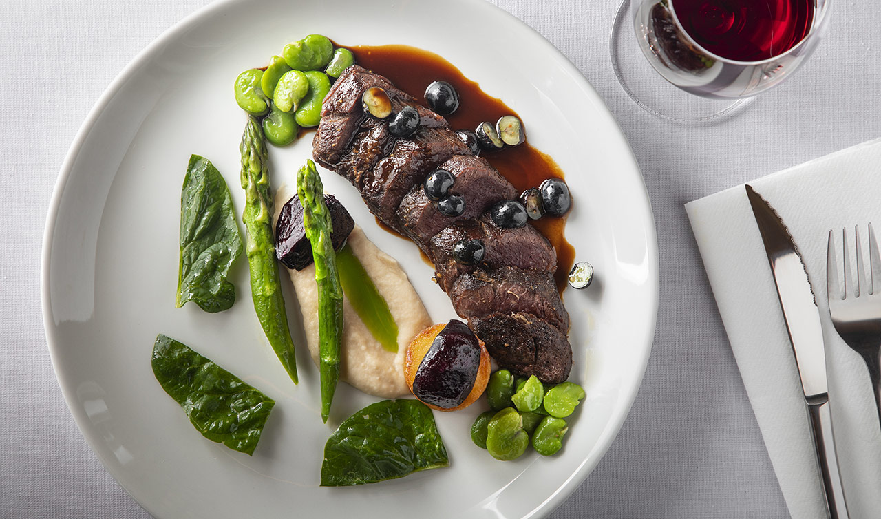 ARKESTE-010 Beautifully plated meat and greens for a casual dining experience
