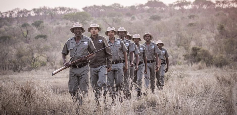Rhino Guardians from the Tracker Academy patrolling the bush as part of anti-poaching efforts.