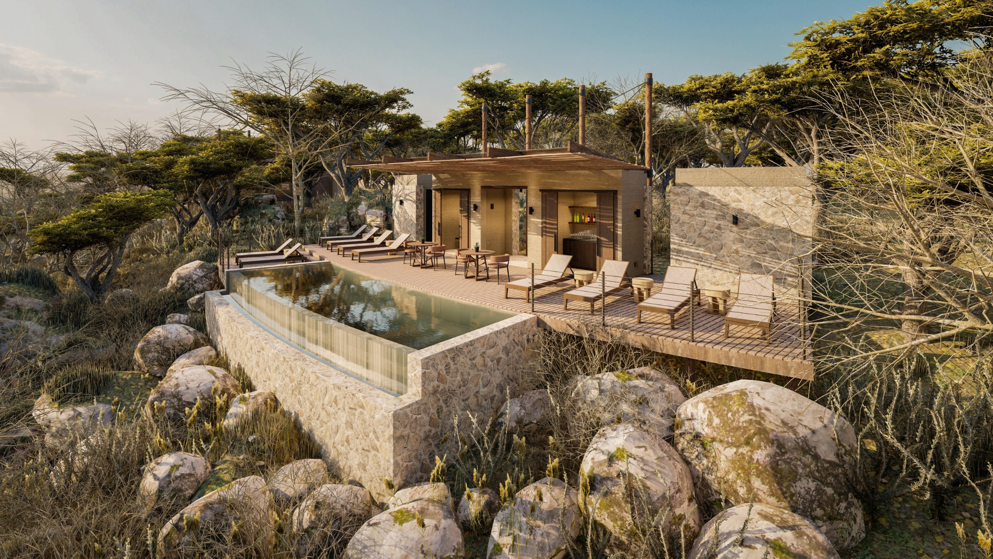 Bupenyu-Lodge-pool An elevated stone-and-timber pool deck sits above the bushveld with loungers, shade structures, and an infinity edge reflecting the late-afternoon light at one of the new luxury safari lodges 2026.