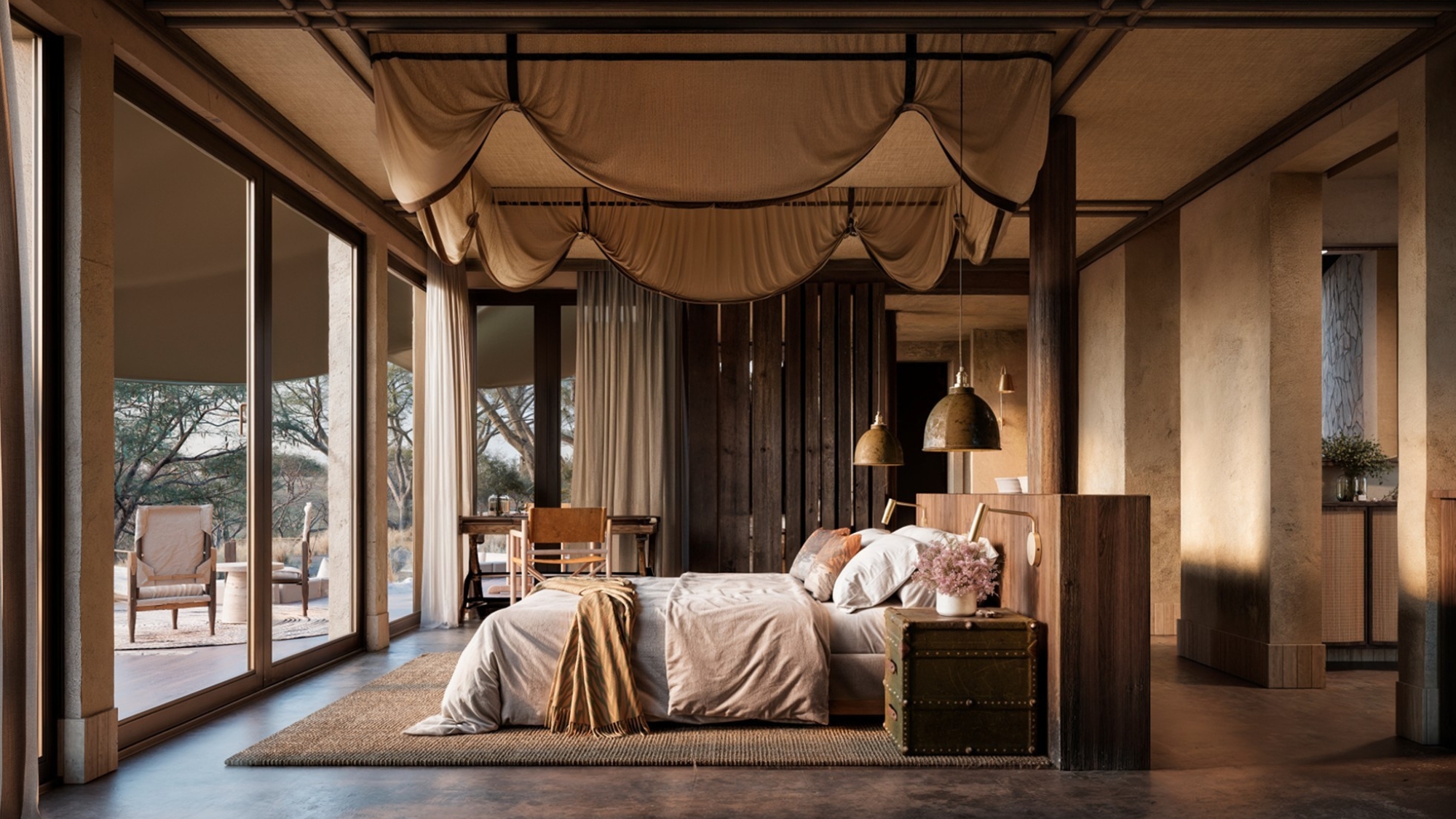N'Weti Camp Interior Bedroom A serene, canvas-topped suite opens onto the bushveld, with soft natural light spilling across a spacious bed and warm, earthy interiors.