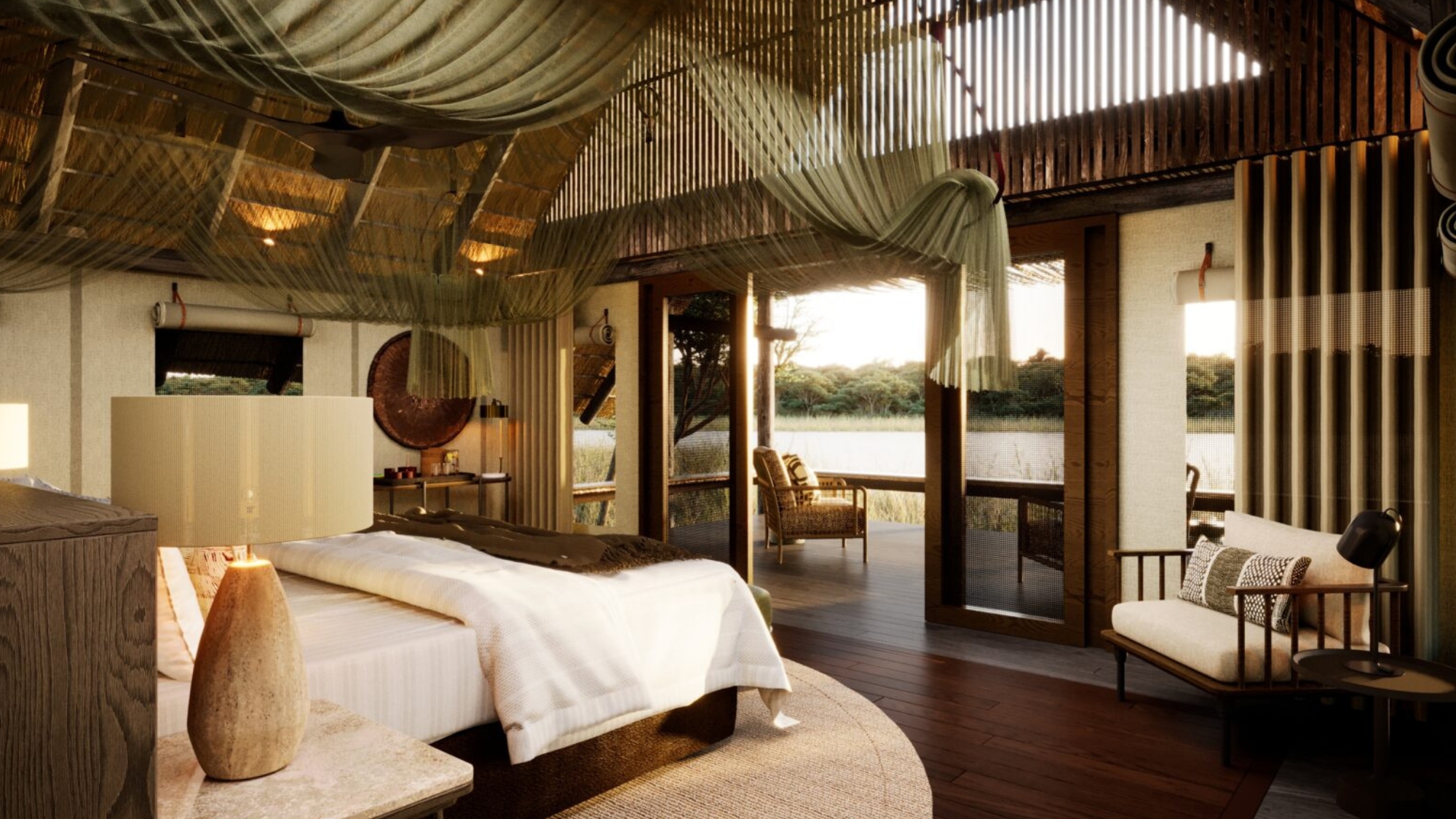 Sediba-Sa-Rona-luxury-lodges-2026-room-view A spacious riverside suite features a draped canopy ceiling, soft natural textures, and an open deck overlooking the water.