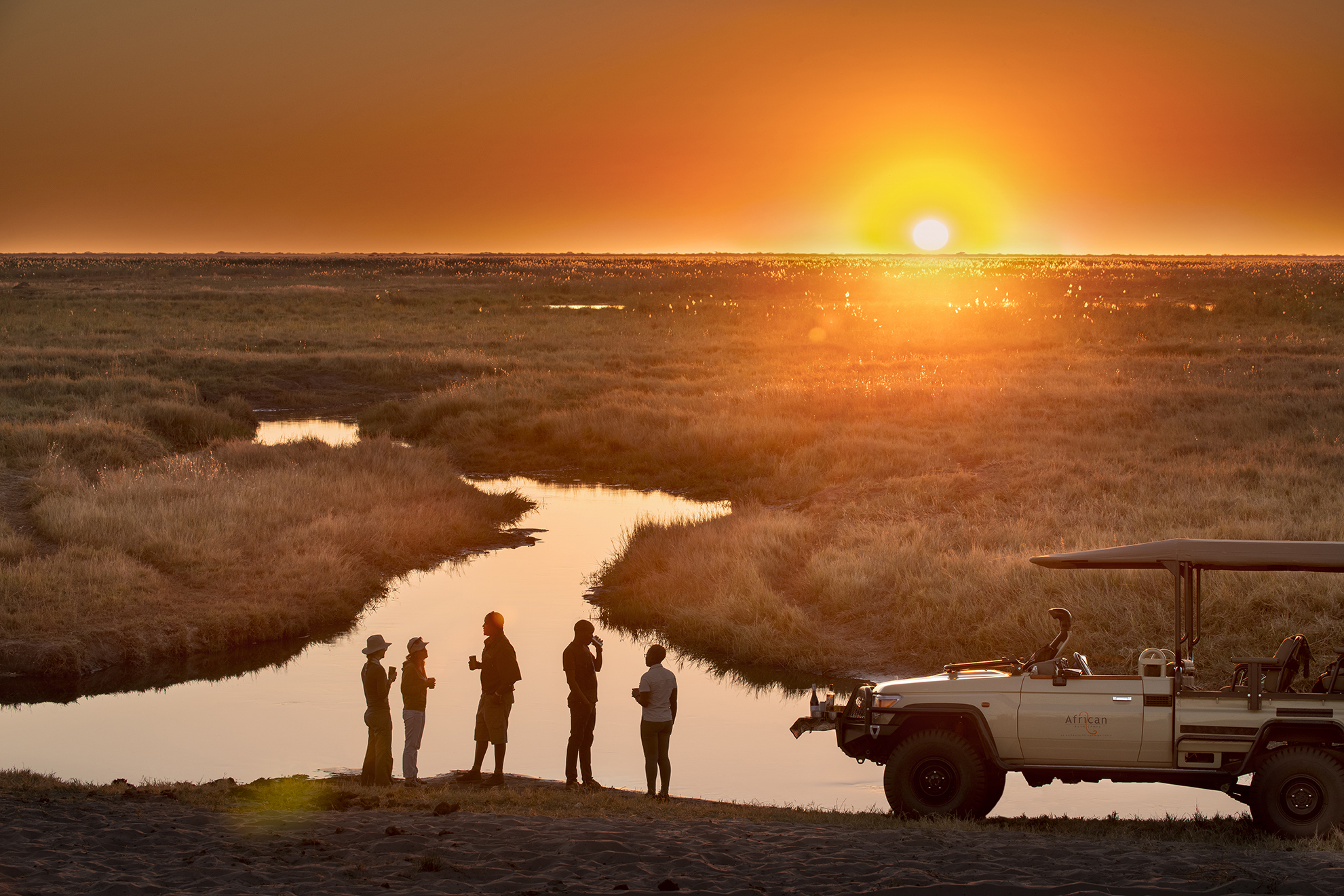 Sundowners at African Bush Camps Linyanti Expeditions	