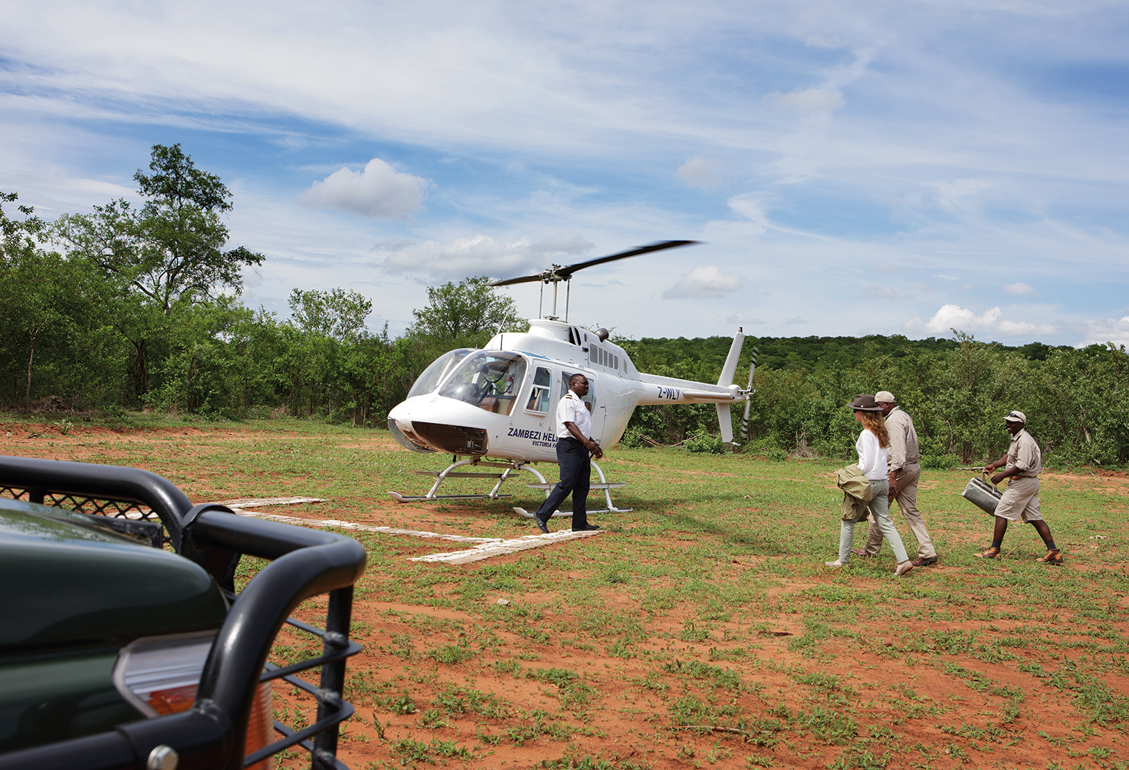 Climbing onboard a helicopter for a tour of Victoria Falls from the sky