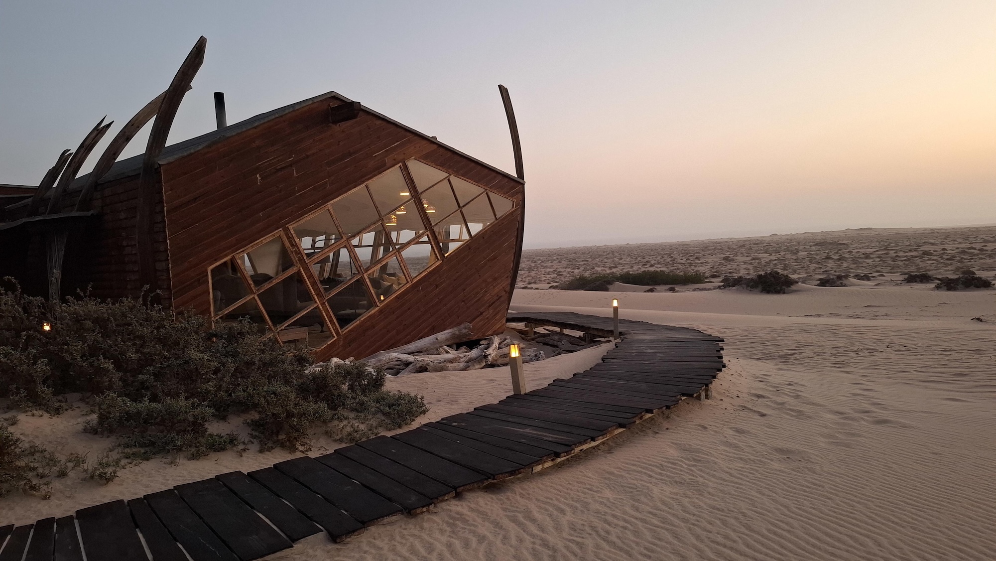 Chalets A wooden cabin overlooking Skeleton Coast, one of the top luxury lodges in Nambia
