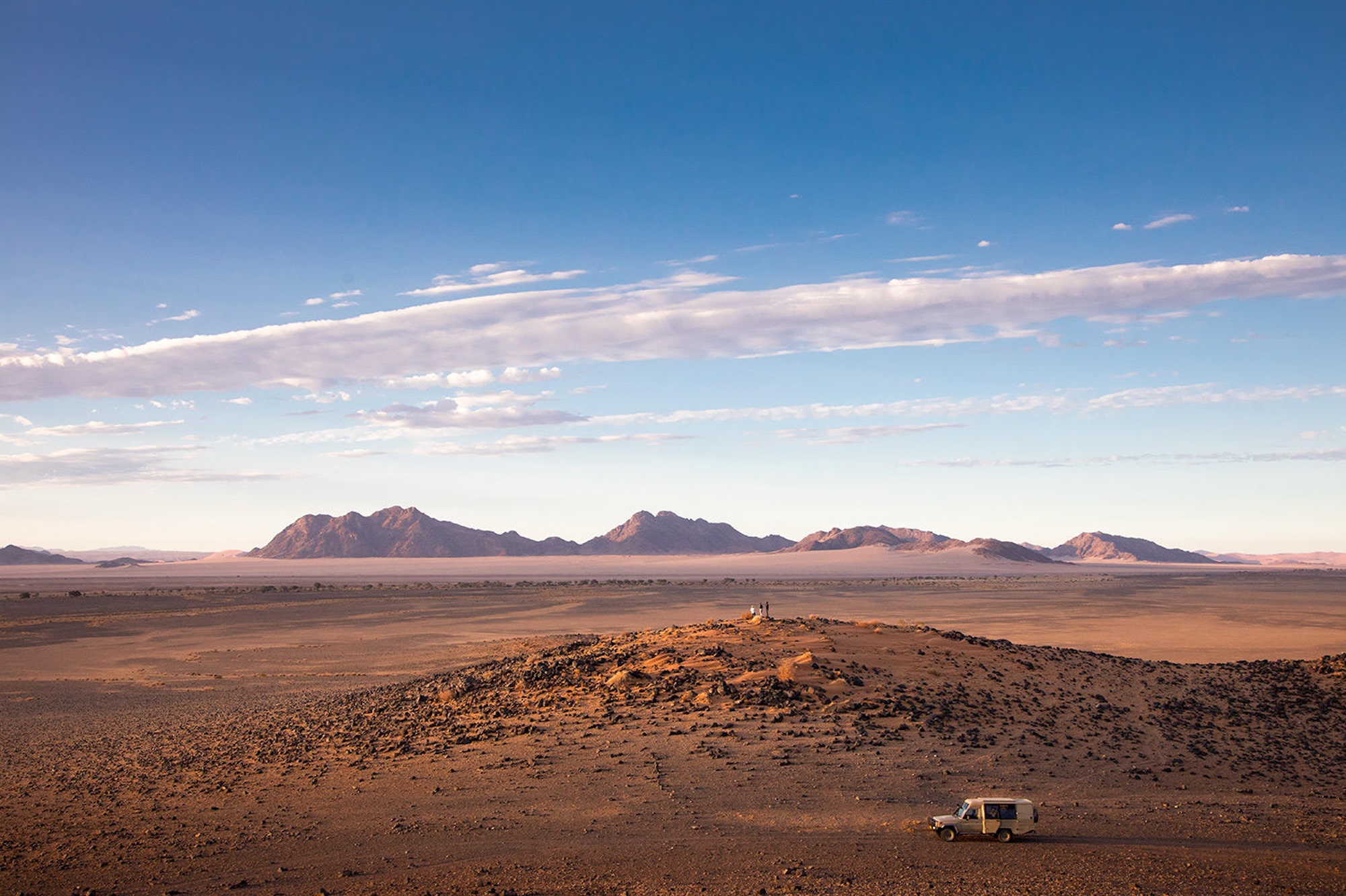 Guests explore the Namibian landscape while on a luxury safari in Namibia