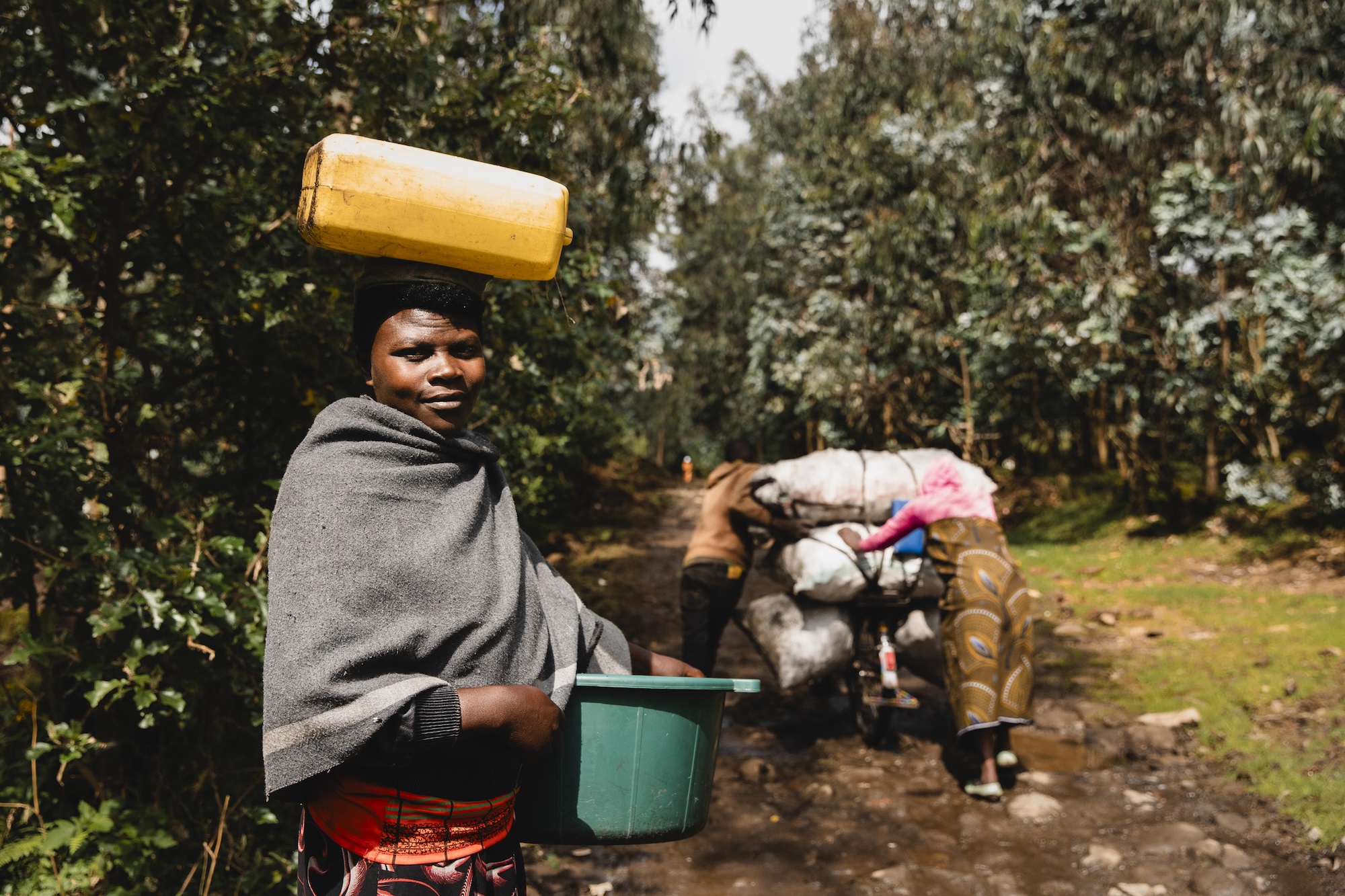 Citizens carry goods through the forests in Rwanda