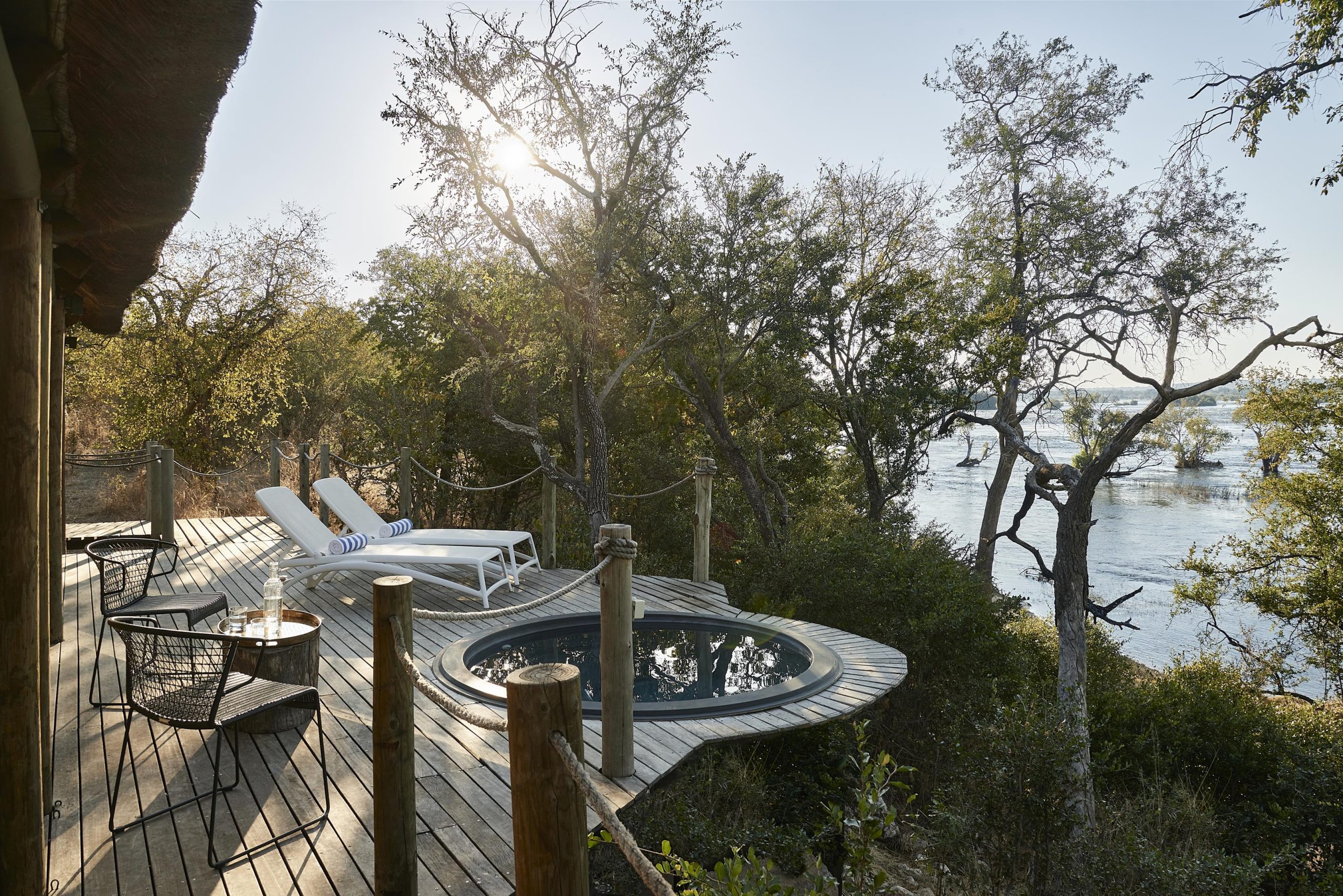 Private riverfront deck at Victoria Falls River Lodge overlooking the Zambezi.